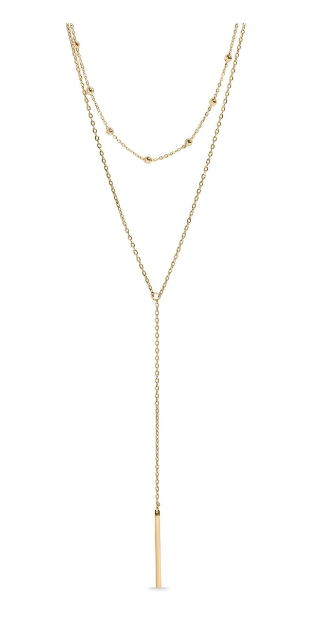 Gold necklace with a bar pendant on a white background